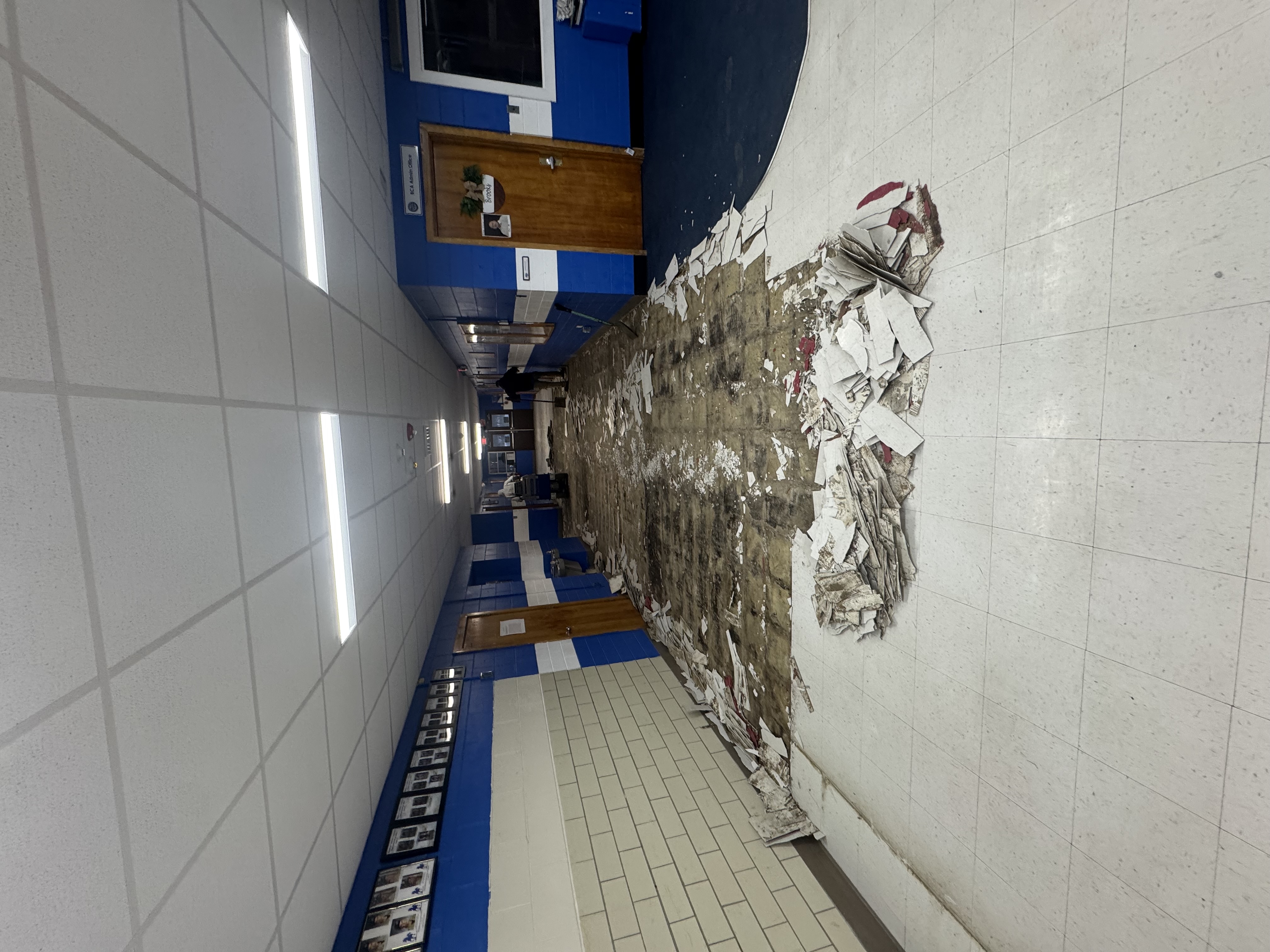 School hallway tile demolition in progress