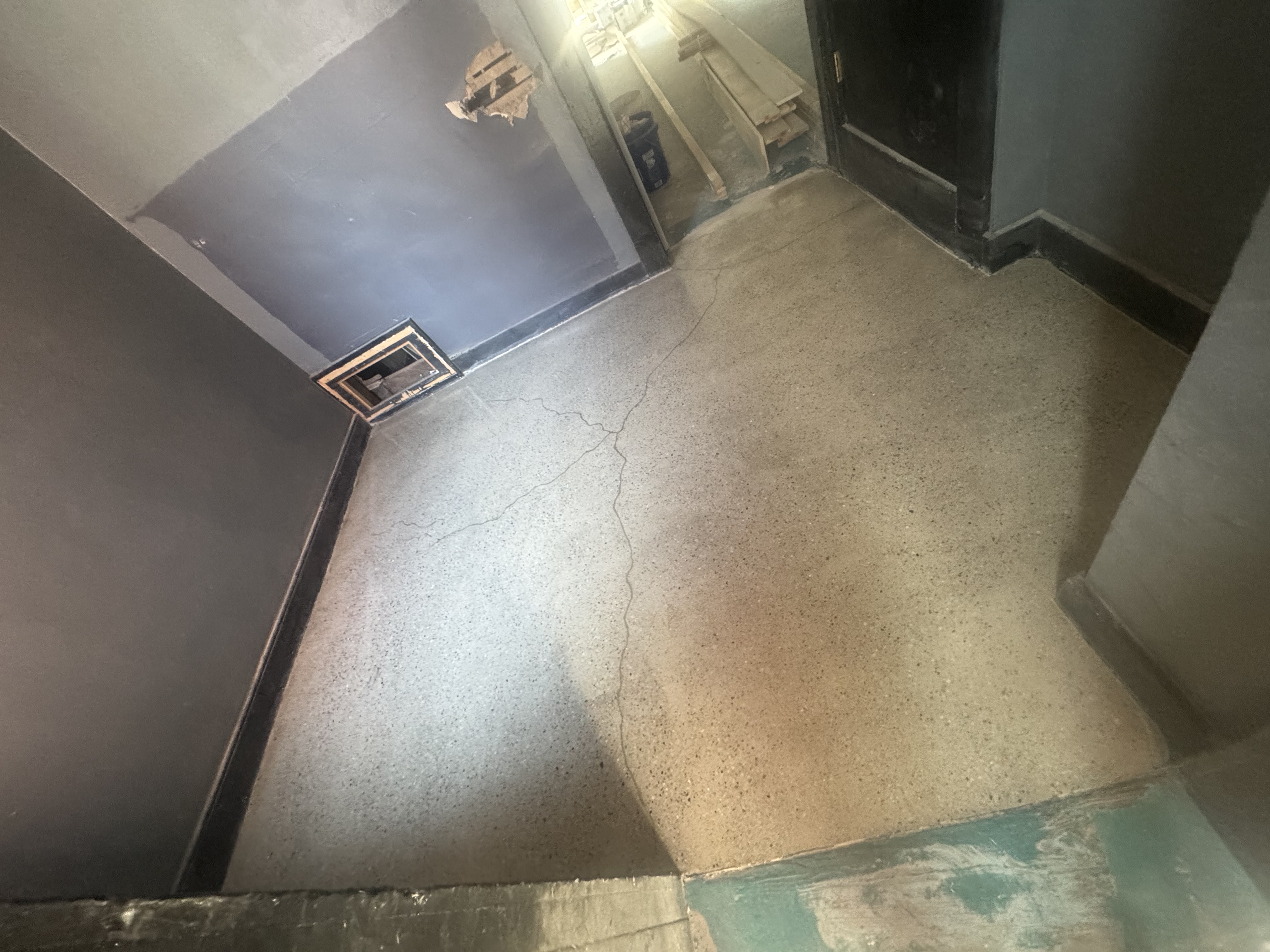 Graffiti building floor after grind and seal