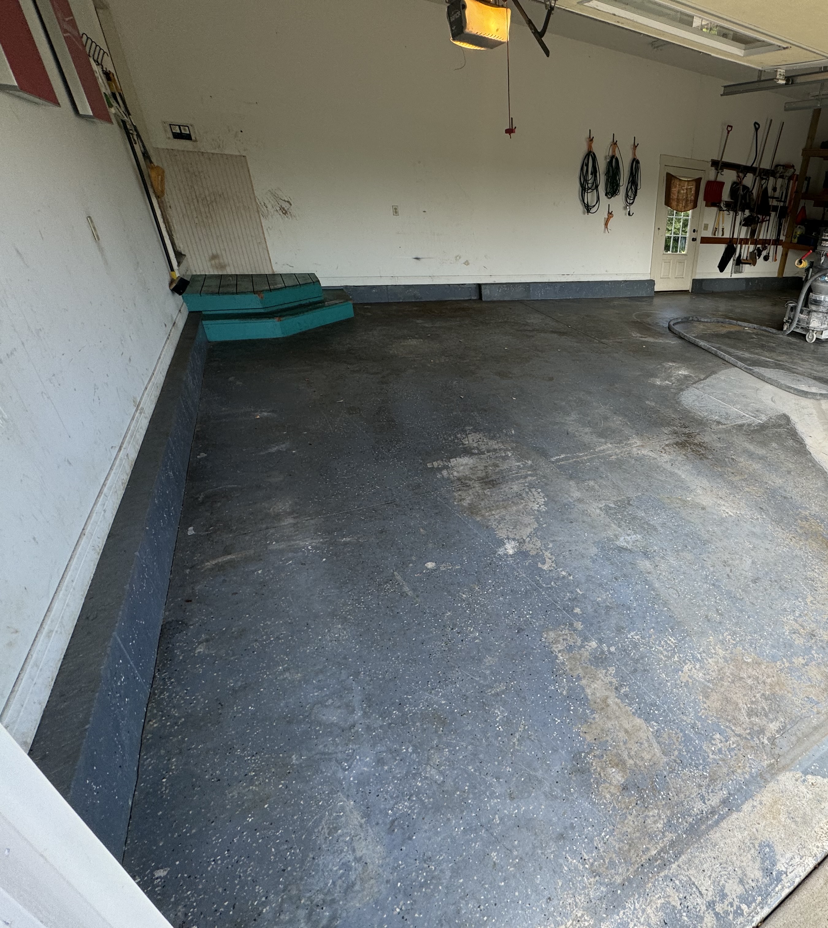 Garage floor during surface preparation